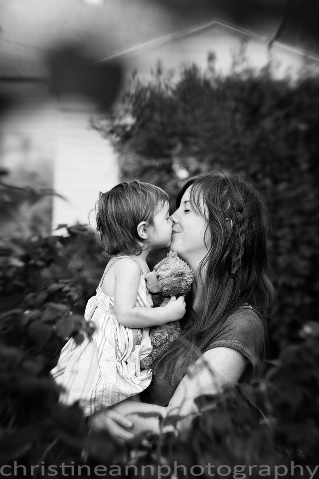Duluth MN Lifestyle Family Session with a beloved teddy bear, apple tree, apples, sleepy kids, balloons, lawnmower, siblings, diaper, laundry, mom, dad - all outdoors in the back yard of their home.