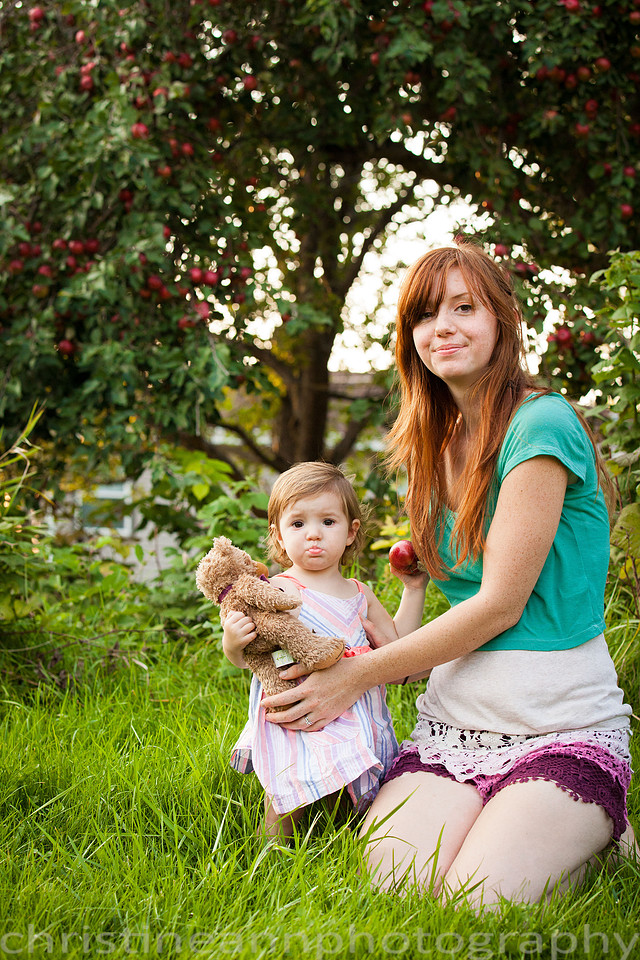 Duluth MN Lifestyle Family Session with a beloved teddy bear, apple tree, apples, sleepy kids, balloons, lawnmower, siblings, diaper, laundry, mom, dad - all outdoors in the back yard of their home.